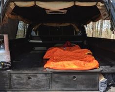 there is an orange blanket in the back of a truck