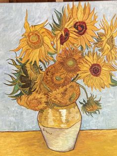 a painting of sunflowers in a yellow vase