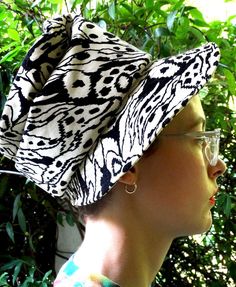 "A-maz-ing 60s era velvet hat that is made to perch on top of one's head for maximum fashion impact. This one's a beauty, and although unlabeled, is in excellent vintage condition. Velvet/velveteen material features an abstract black-on-cream pattern and stitch-reinforced brim with groovy spiral-gathered top. Full lined and Union-made, with original union label. Inside circumference is about 21\" at hat band; about 7.5\" diameter x about 7\" tall. Brim tapers at back and is 3\" wide at widest. N Retro Visor Hat, Retro Hat With Curved Brim One Size, Retro Hat With Curved Brim, Retro Brimmed Hat, One Size Fits Most, Retro Brimmed Hat One Size Fits Most, Retro Cap Hat One Size, Retro One-size Cap, Retro One Size Cap, Retro Cap