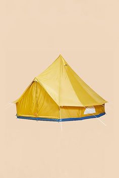 a yellow and blue tent flying in the air with no one around it on a tan background