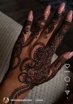 a woman's hand with henna tattoos on it and the words, i love you