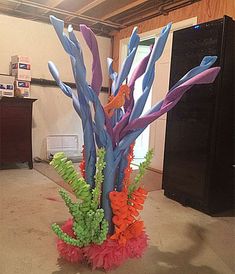 a vase filled with colorful flowers on top of a floor