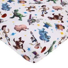 a white sheet with toy story characters on it and stars in the sky around them