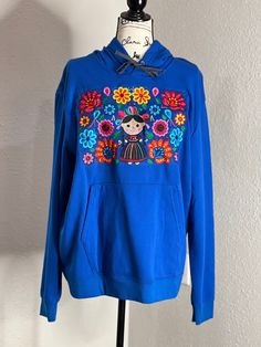 Blue  Size XL  Machine embroidery- hand manipulated  This a unique sweater, not restock.  Unique and one of kind. Bust - 25" side  Bust 50" all around bust area. Blue Hooded Hoodie With Embroidered Graphics, Embroidered Blue Cotton Sweater, Blue Long Sleeve Sweater With Embroidered Graphics, Blue Embroidered Cotton Sweater, Blue Embroidered Cotton Hoodie, Embroidered Blue Sweatshirt For Fall, Blue Embroidered Long Sleeve Sweater, Embroidered Hooded Sweater For Fall, Unique Sweater