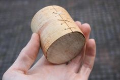 a person holding a wine cork in their hand