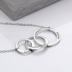 This Personalized Intertwined Circle Necklace collection contains a sterling silver pendant of three intertwined rings with text engraved in it. This pendant comes with an 18-inch chain. Crafted in high-quality material, this stylish pendant necklace is made of sterling silver and intertwined rings. Nickel-free and lead-free this hypoallergenic jewelry are very skin-friendly even for susceptible skin. The plating is non-allergic and safe for all environments and skin conditions. It is advisable Interlocking Ring, Gift Idea For Mom, Friendship Jewelry, Friendship Necklaces, Necklace For Her, Great Gifts For Women, Silver Circle, Personalized Gifts For Her, Engraved Jewelry