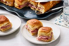 ham and cheese sandwich cut in half on plates