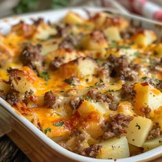 a casserole dish with meat and potatoes in it