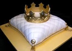 a white cake with a gold crown on top