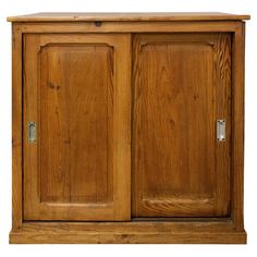 a wooden cabinet with two doors on the front