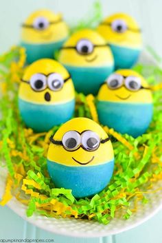 some yellow and blue eggs with eyes on them