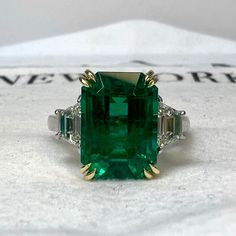 DETAILS Emerald Weight: 5.34 CTS Diamond Weight: 0.95 CTS Metal: Platinum/18K Yellow Gold Basket Gold Weight: 7.3 gm Ring Size: 6 Shape: Emerald-Cut Color: Intense Green Hardness: 7.5-8 Birthstone: May CD Certified CUSTOM ORDER We customize high jewelry made with quality gemstones and diamonds. Please allow custom order 1-2 weeks.  * Extensive collection of colored gemstones for you to choose from - Emerald, Ruby, Sapphire, Alexandrite (+ some collection of semi precious) * CAD - any 3D design  * Made in USA SHIPPING All items will be shipped in safe and protective packaging within 1 day including tracking.  Please contact for more details about our products or custom orders!  EMERALD BIRTHSTONE The May birthstone, Emerald, was dedicated to Venus, the goddess of love and beauty. It promote Luxury Green Sapphire Ring Gia Certified, Green Gia Certified Sapphire Ring, Green Gia Certified Luxury Sapphire Ring, Luxury Gia Certified Emerald Cut Gemstones, Luxury Emerald Cluster Ring With Vvs Clarity, Luxury Emerald Ring With Accent Stones For Formal Occasions, Formal Green Sapphire Ring With Diamond, Formal Green Sapphire Diamond Ring, Luxury Emerald Rings With Diamond Cut