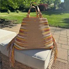 Lightly Used, This Tote Has Great Capacity, Perfect Beach Tote. Center Toggle Closure So Can Be Worn Two Ways. Minor Wear In Interior Lining Double Top Handles, 5.18" Drop Dimensions: 15.94"W X 5.98"D X 14.34"H Toggle Closure Interior Zip Pocket, Interior Slip Pocket Woven Design Fringe Detail On Sides Lined Cotton Twill/Rayon; Trim: Leather; Lining: Cotton Imported Tory Burch Bags, Woven Design, Tory Burch Bag, Beach Tote, Womens Tote Bags, Cotton Twill, Tory Burch, Zip Pockets, Handles