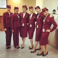 the flight attendants are all dressed in red