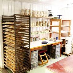 a room filled with lots of different types of pottery