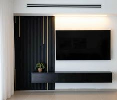 a large flat screen tv mounted to the side of a wall