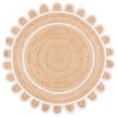 a round rug with white and beige circles on the bottom, in front of a white background