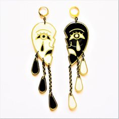 Black and White Sad Crying Face Drama Earrings.  Handpainted Resin Earrings.These earrings make a statement!  One side is white and one side is black with tear drops dangling from them.Stainless steel huggie hoops.  Stainless steel chain.About 5 inches long in total.  Super lightweight as always.Comes gift wrapped. Artistic Black Dangle Jewelry, Artistic Black Dangle Earrings, Artistic Black Enamel Jewelry, Artistic Black Drop Earrings, Crying Face, Multiple Earrings, Cardboard Jewelry Boxes, Dog Earrings, Earring Cards