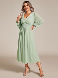 Step into any wedding celebration with confidence in our Plus Size Flowy Long Sleeves V-Neck Midi Chiffon Wedding Guest Dress. The airy chiffon fabric drapes beautifully around your curves, offering a flattering and effortless look. With its versatile midi length and long sleeves, this dress fits perfectly into any evening affair. Whether it's a grand ballroom reception or an intimate candlelit dinner, you'll feel like the belle of the ball, radiating elegance and charm in this captivating ensemble. Chiffon Wedding Dress With Ruched Bodice, Flowy Green Chiffon Dress For Wedding, Green Chiffon Wedding Dress, Flowy Chiffon V-neck Dress For Wedding Guests, Flowy V-neck Bridesmaid Dress For Wedding Guests, Spring Wedding Chiffon V-neck Dress, Flowy Chiffon Dress With Ruched Bodice For Weddings, Spring Wedding Chiffon Bridesmaid Dress, Ruched Chiffon Bridesmaid Dress