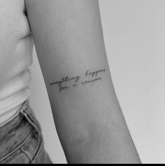 a woman with a tattoo on her arm saying something happens