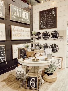 there are many signs on the wall in this store that say gather and be together