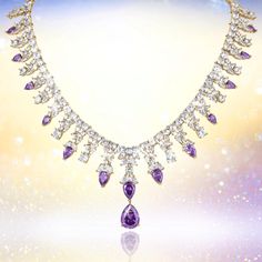 Indulge yourself in this shimmering bonanza. This necklace oozes style and sophistication and is sure to make you stand out in a crowd. The mount is expertly set with shimmering, deep regal purple and ice white Diamondeau®, flawless simulated diamond. The necklace is given a truly decadent feel with a glimmering golden finish. Complete the look with the matching earrings making you statement ready for the festive season. Luxury Purple Jeweled Necklace, Luxury Purple Elegant Crystal Necklaces, Luxury Oval Purple Necklace, Elegant Purple Faceted Crystal Necklace, Luxury Ornate Purple Necklace, Earrings Making, Latest Jewellery, Stone Design, Gold Pearl