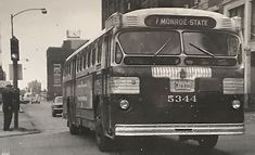 an old black and white photo of a city bus