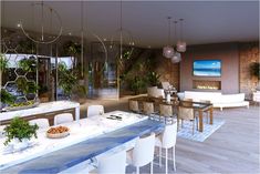 a large dining room with white chairs and plants on the table in front of it