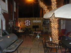 an outdoor patio with lights strung around it