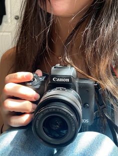 a woman taking a photo with her camera