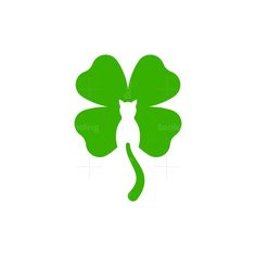 the four leaf clover is green and has a cat's tail sticking out of it