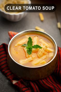 a close up of a bowl of soup on a table