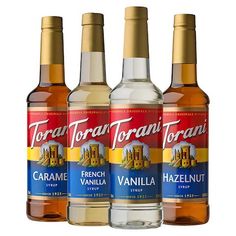 three bottles of torani torani vanilla syrup are shown in this undated image