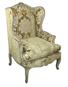 an old fashioned chair is upholstered with fabric