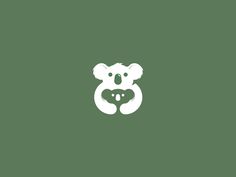 a white koala bear on a green background