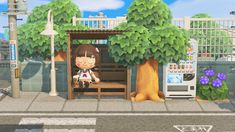 an animal crossing the street in front of a building with trees and flowers on it