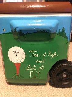 a toy truck with a golf theme painted on it's side and the words, tie it high and let it fly