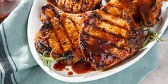 grilled pork chops with barbecue sauce on a plate