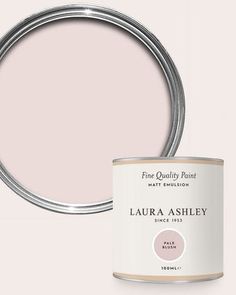 a pink paint can with the words,'fine quality paint'in white lettering