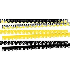 some black and yellow paper strips on a white background with the words believe in sparkle