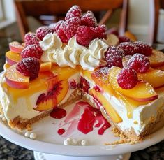 there is a cake with fruit on the top and white frosting in the middle