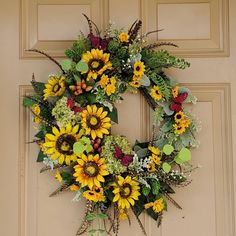 a sunflower wreath is hanging on the front door