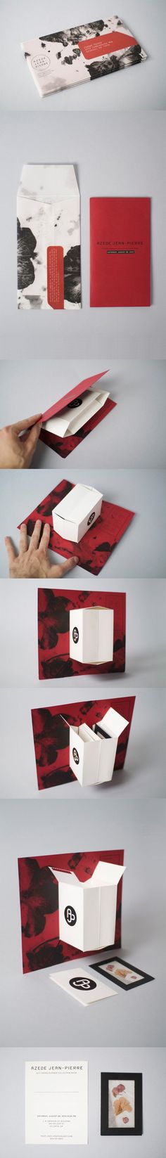 an assortment of red and white boxes with different designs on them, all stacked together