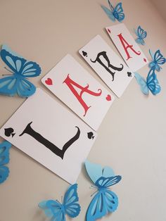 butterflies and cards with the letter a on them