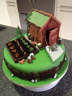 there is a cake that looks like a farm scene