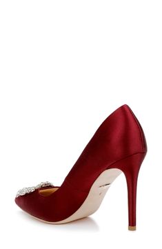 A gorgeous crystal brooch crowns the pointed toe of a glossy satin pump lifted by a tapered heel. 4" heel, 1/8" platform (size 8.5) 2 1/2" shaft Latex foam-cushioned footbed Textile upper/synthetic and textile lining/leather sole Imported Women's Shoes Boy Activewear, Burgundy Shoes, Walker Shoes, Satin Pumps, Crystal Brooch, Designer Clothes For Men, Modern Outfits, Toddler Girl Outfits, Badgley Mischka