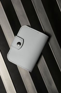 This wonderful white bifold wallet -- a perfect combination of elegance and practicality. Crafted from high-quality leather, it features a slim design and plenty of pockets for convenient storage of cash, credit cards, and coins. With customization options available, this wallet makes a unique gift, ideal for both yourself and your loved ones. It's more than just an accessory -- it's an expression of your style and individuality that will elevate your look in any situation. Material: genuine lea Modern White Wallet With Rfid Blocking, Modern White Bifold Wallet, Modern White Leather Wallet, White Card Holder With Interior Slots For Everyday Use, White Bifold Card Holder With Interior Slots, White Bifold Wallet With Rfid Blocking, White Card Holder With Interior Slots, White Rfid Blocking Card Holder For Daily Use, White Bifold Wallet With Card Slots