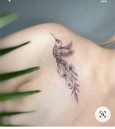 a woman with a tattoo on her shoulder