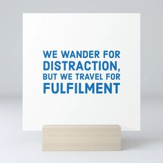 a card with the words we wander for attraction, but we travel for fulfillment on it