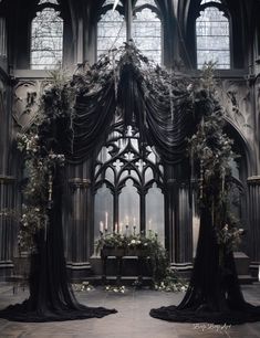 an elaborate archway with flowers and candles in it